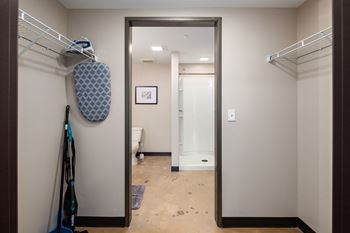 A large mirror in a walk in closet